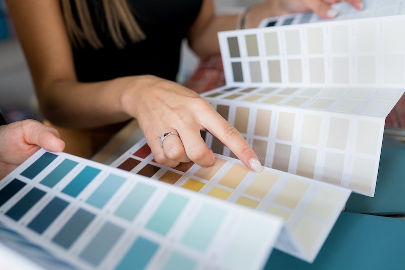 woman selecting paint colors